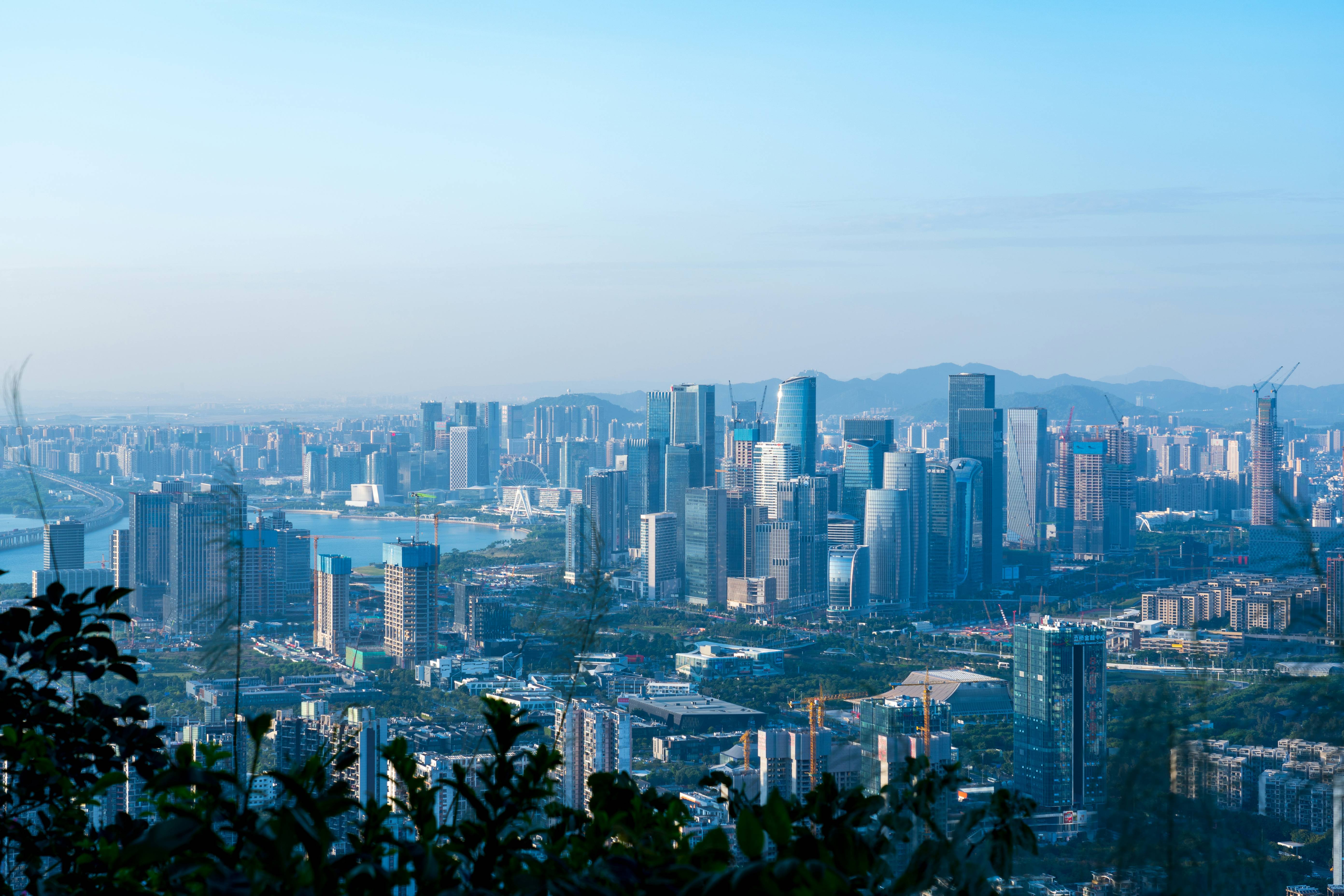 a view of a city from the top of a hill